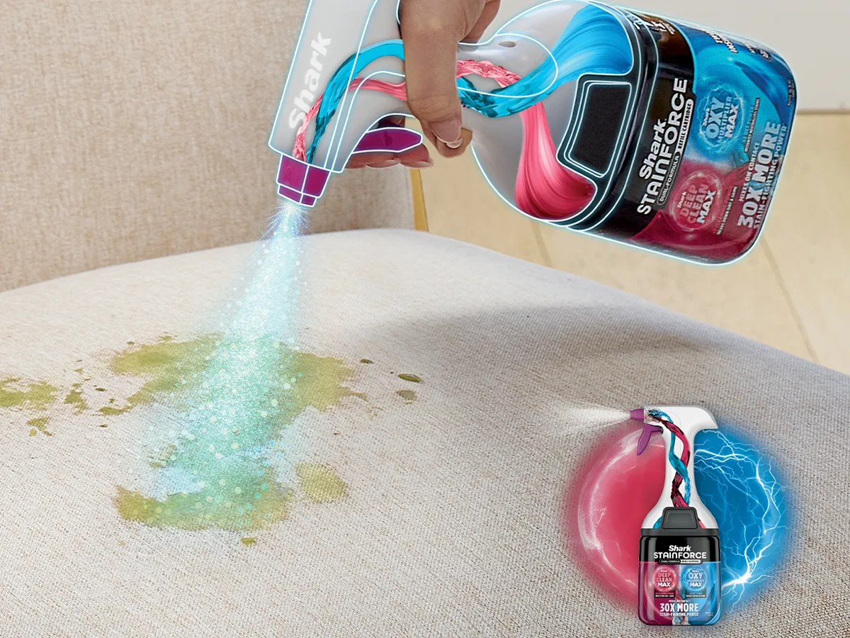 Pretreat spray misting a stain on a cream sofa